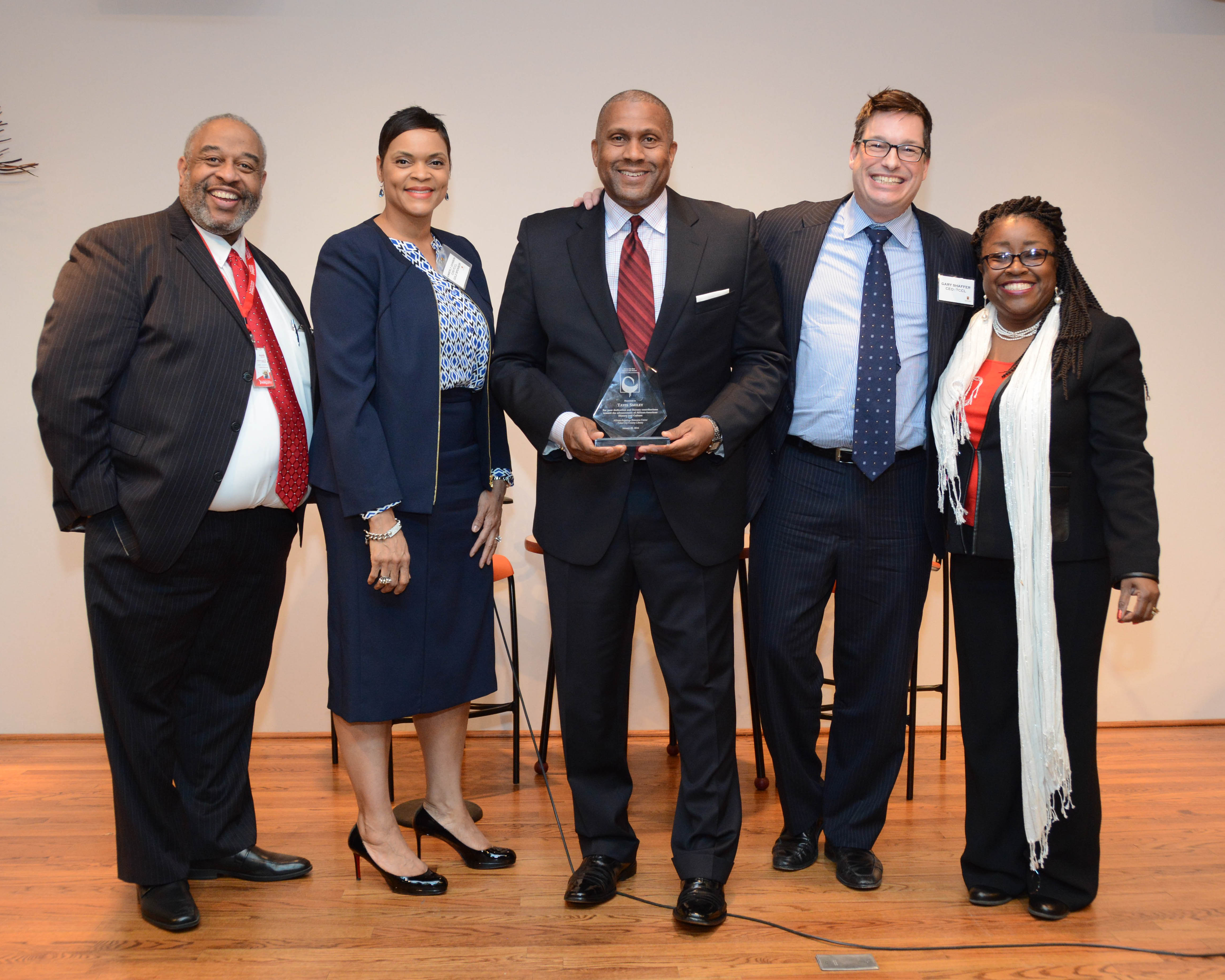 Sankofa award winner with staff