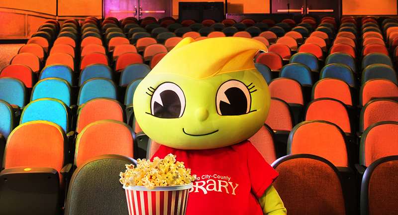 Buddy Bookworm with popcorn at the movies