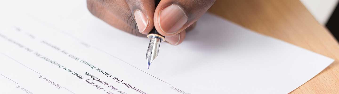 Man signing a contract