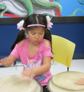 girl playing drums