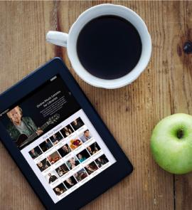 tablet and coffee cup on a table