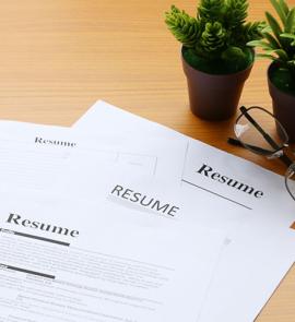 several resumes on a desk