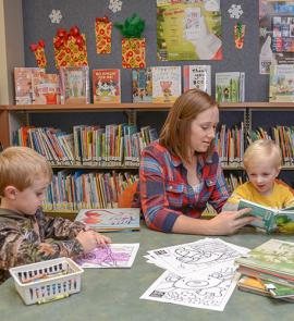 Mom reading with boys
