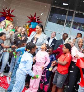 ribbon cutting celebration with people smiling