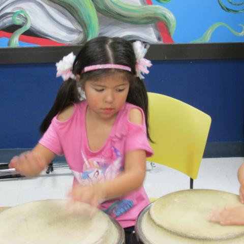 girl playing drum