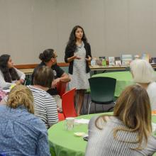 a woman speaks at a program